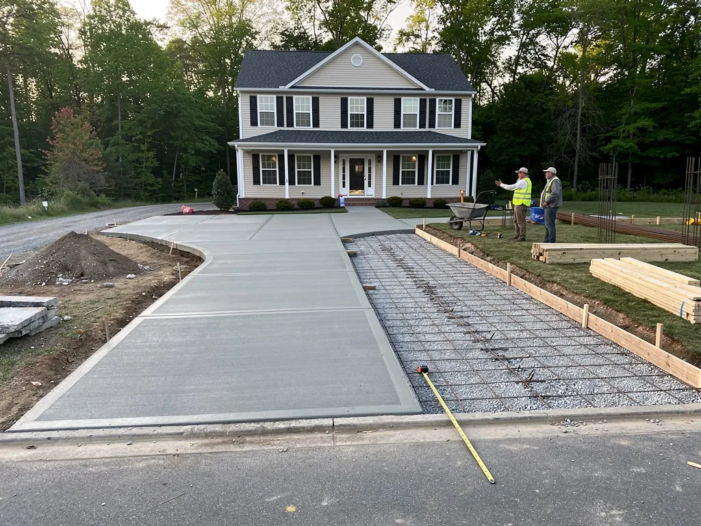 Concrete mix, reinforcement, and site prep factors affecting driveway pricing