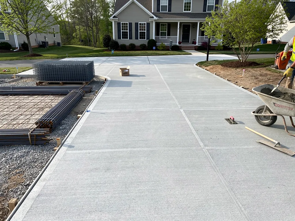 Wire mesh reinforcement laid beneath a concrete driveway base
